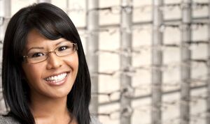 Woman smiling while testing new glasses